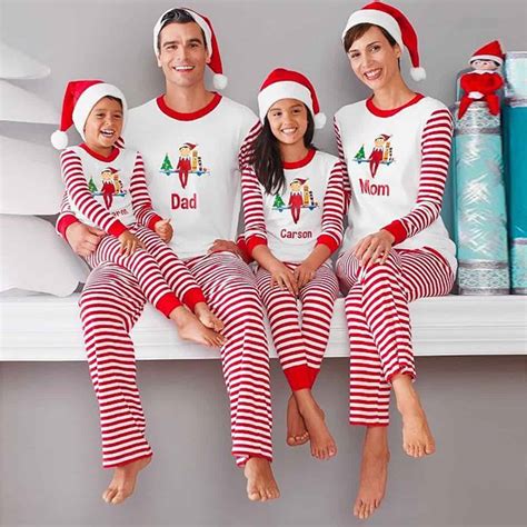 Matching plaid pajamas with Santa hats christmas pjs family picture ideas